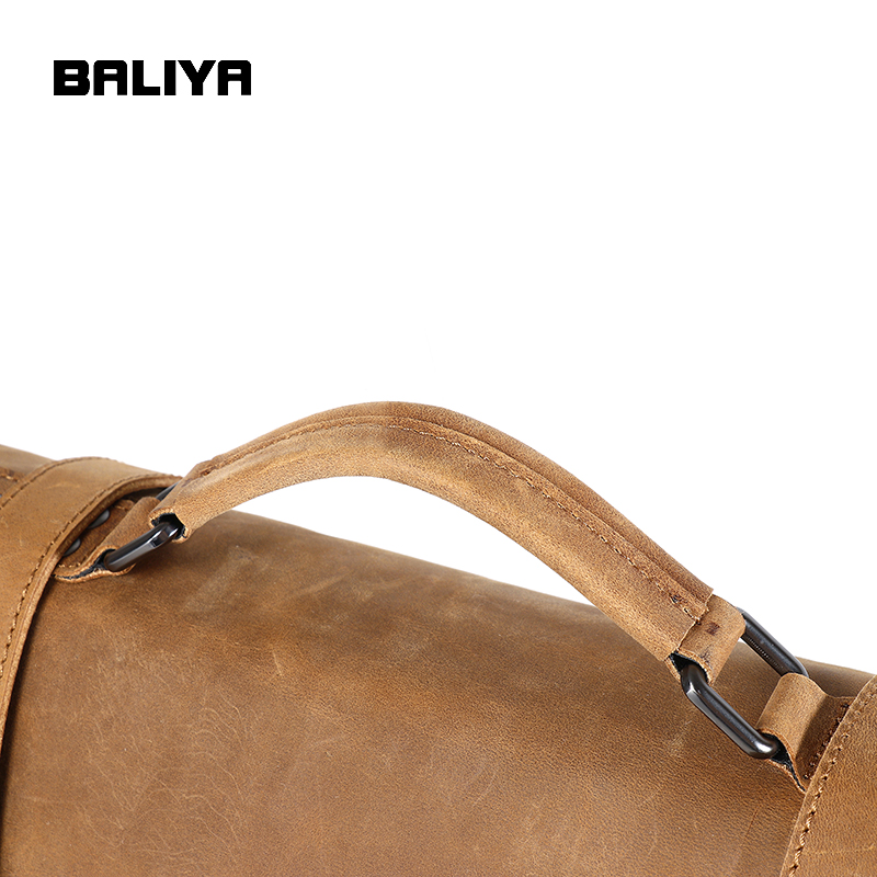 The photo showcases a close-up of the sturdy leather handle, highlighting the bag's craftsmanship and comfortable grip.