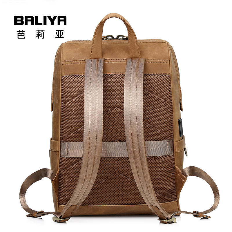 This photo showcases the back view of a BALIYA brown leather backpack, featuring breathable mesh padding, adjustable shoulder straps, and a top handle for comfortable carrying.