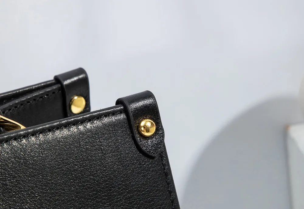 This BALIYA tote is crafted from premium Italian cowhide for a luxuriously soft feel. Shining gold rivets enhance the design and structure for added durability.