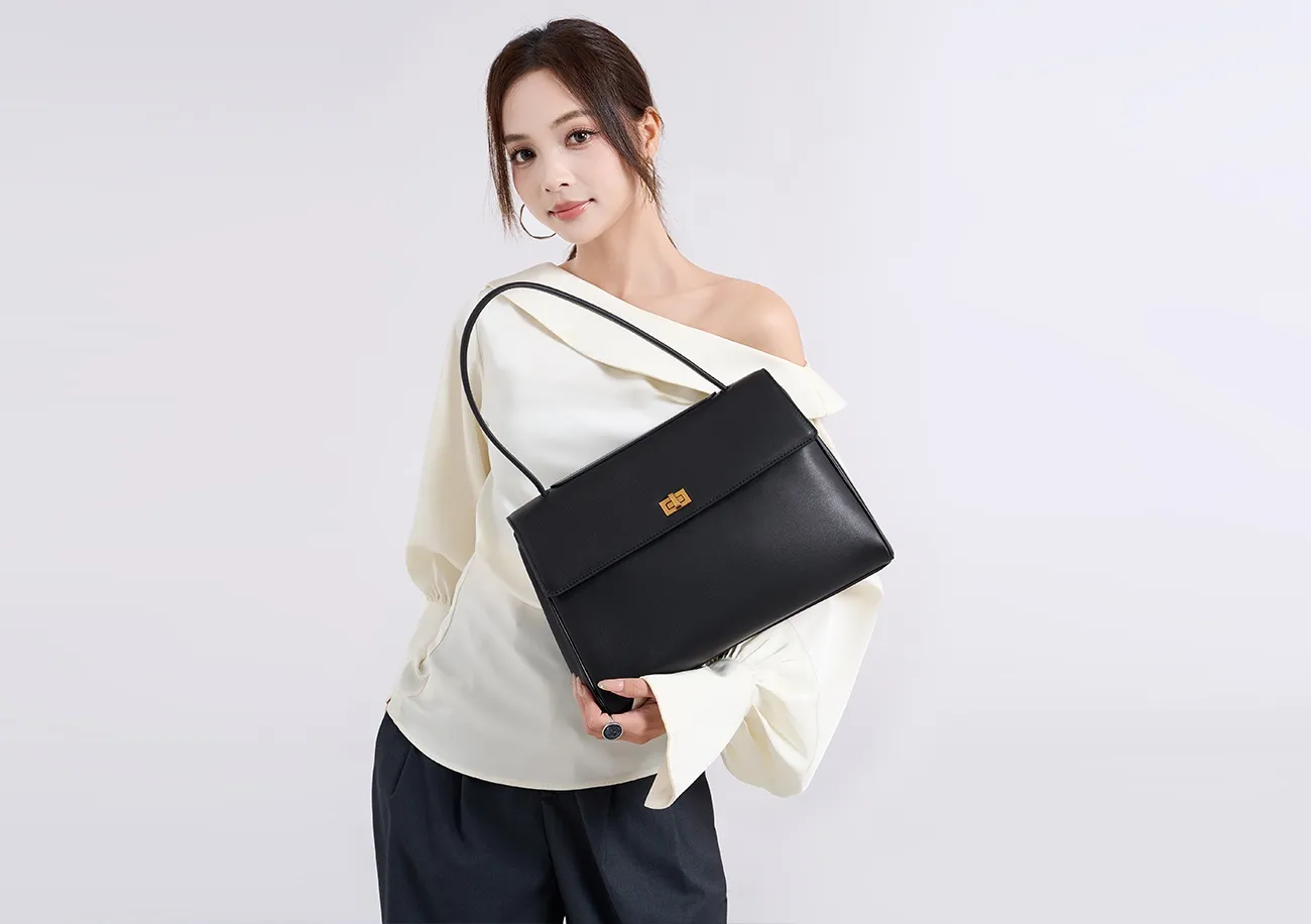 The tote bag offers ample space for daily essentials, books, and a laptop, combining style with practicality for versatile use.