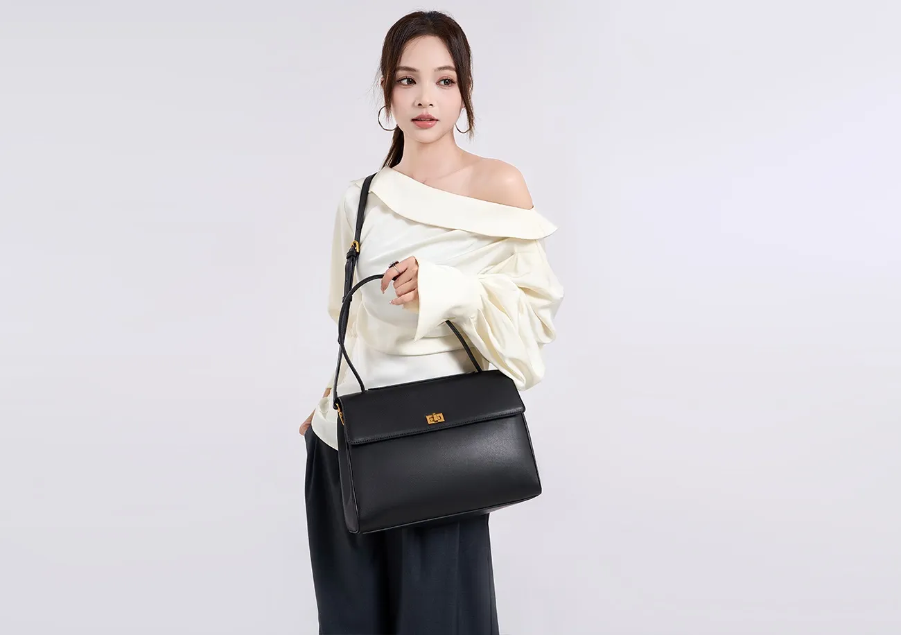 The tote bag offers ample space for daily essentials, books, and a laptop, combining style with practicality for versatile use.
