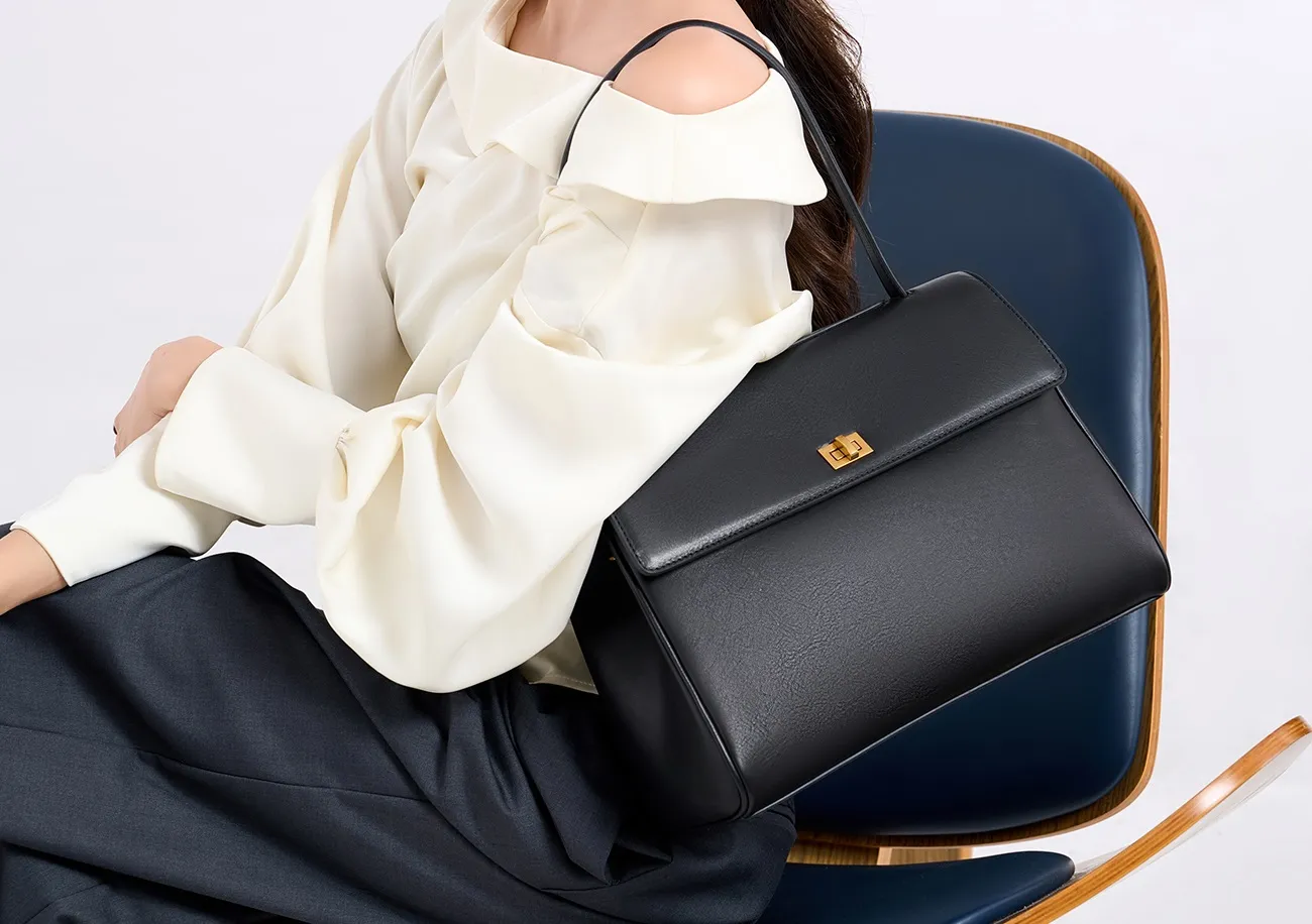 The tote bag offers ample space for daily essentials, books, and a laptop, combining style with practicality for versatile use.