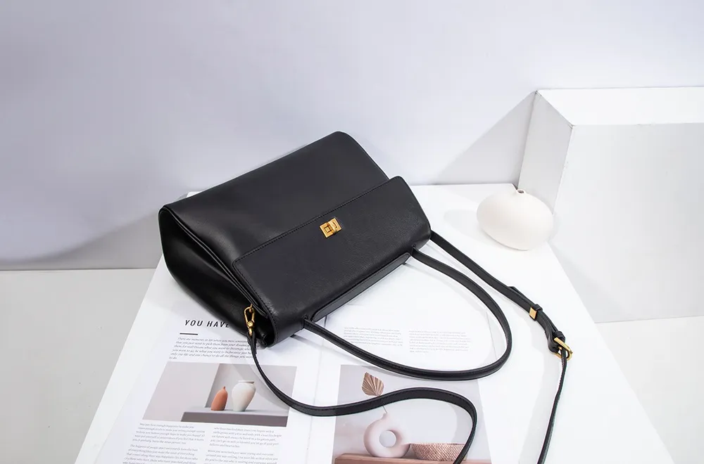 The red tote bag offers ample space for daily essentials, books, and a laptop, combining style with practicality for versatile use