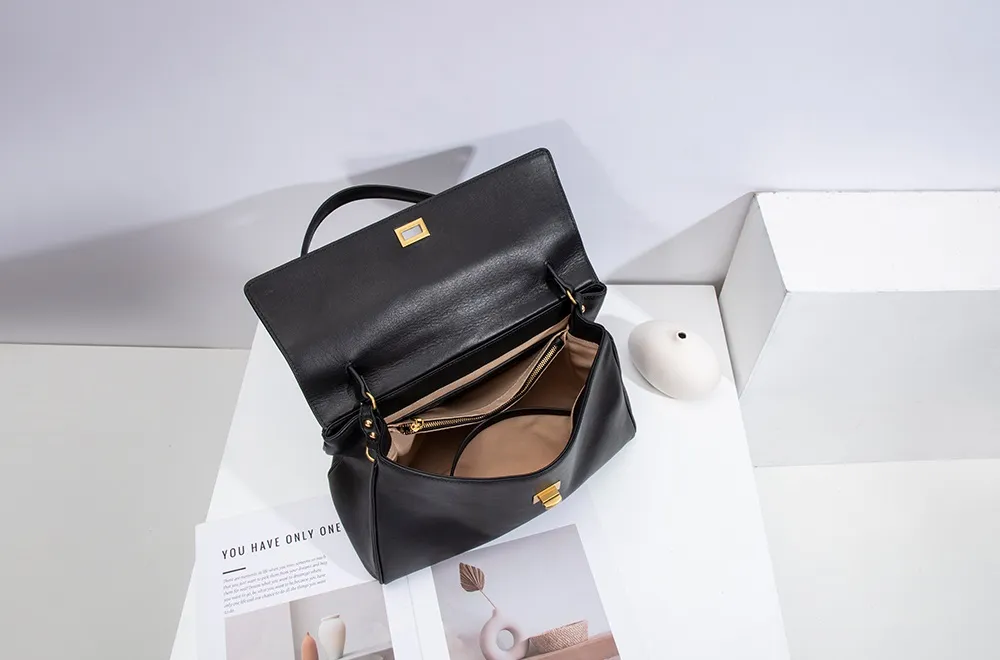 The red tote bag offers ample space for daily essentials, books, and a laptop, combining style with practicality for versatile use