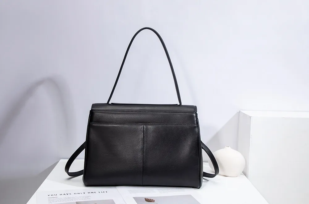 The red tote bag offers ample space for daily essentials, books, and a laptop, combining style with practicality for versatile use
