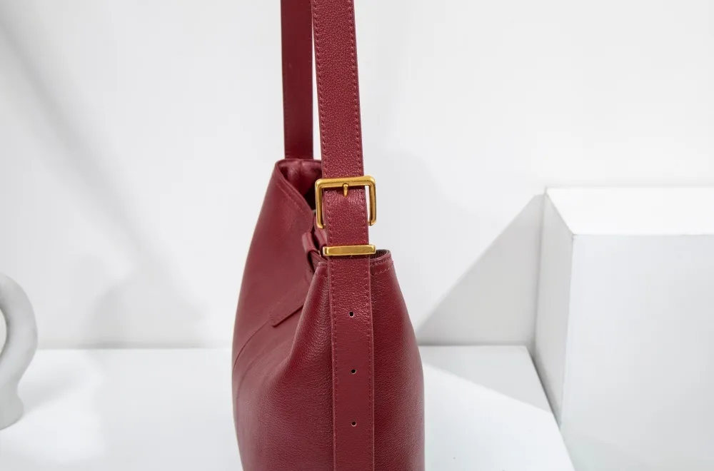 Genuine leather women's shoulder bag with adjustable strap—stylish, durable, perfect for any occasion.