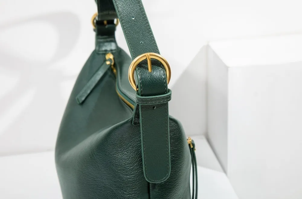 Genuine leather women's bag with adjustable metal strap—chic, sturdy, fits any look. Easy to tweak, perfect!