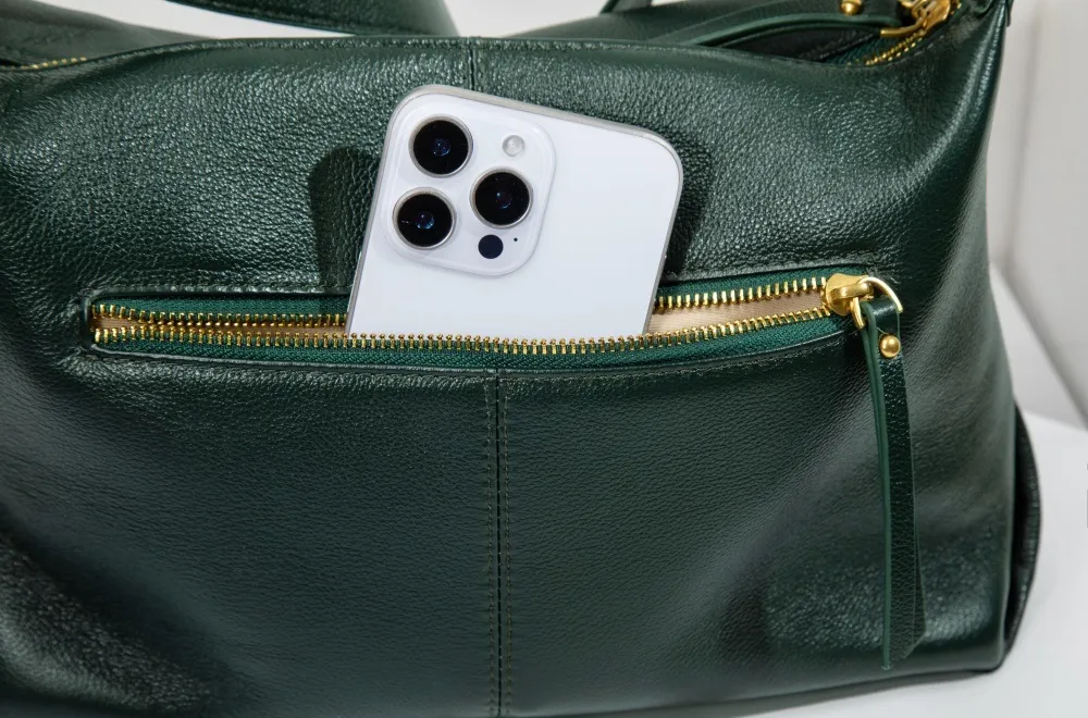 This leather bag has an external zip pocket—handy for quick-access essentials, secure and sleek.