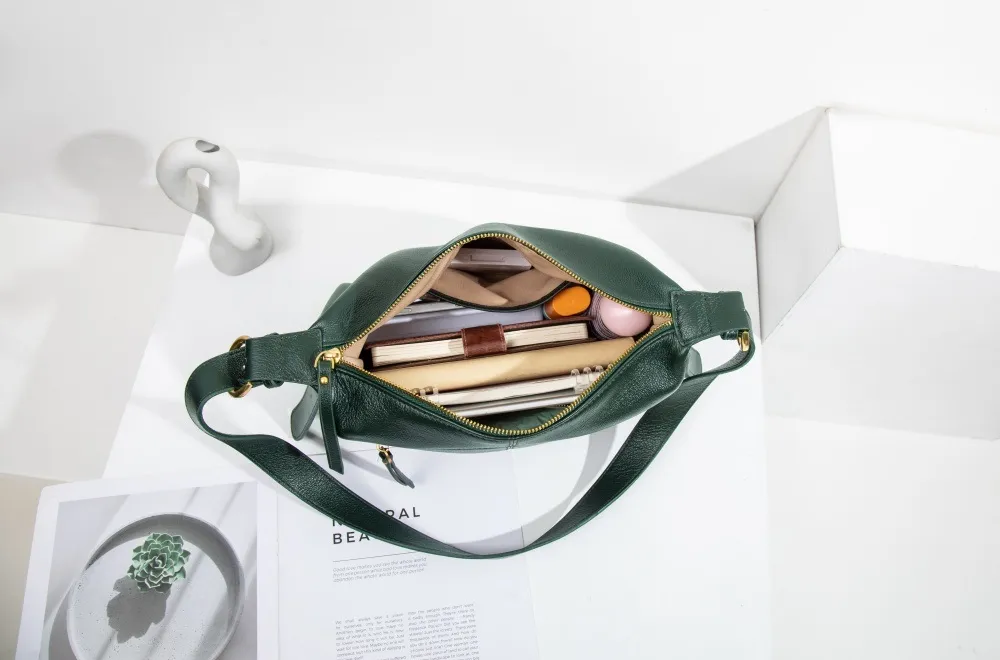 This genuine leather bag holds tons—spacious inside, neat outside. Fits all your daily essentials easily!