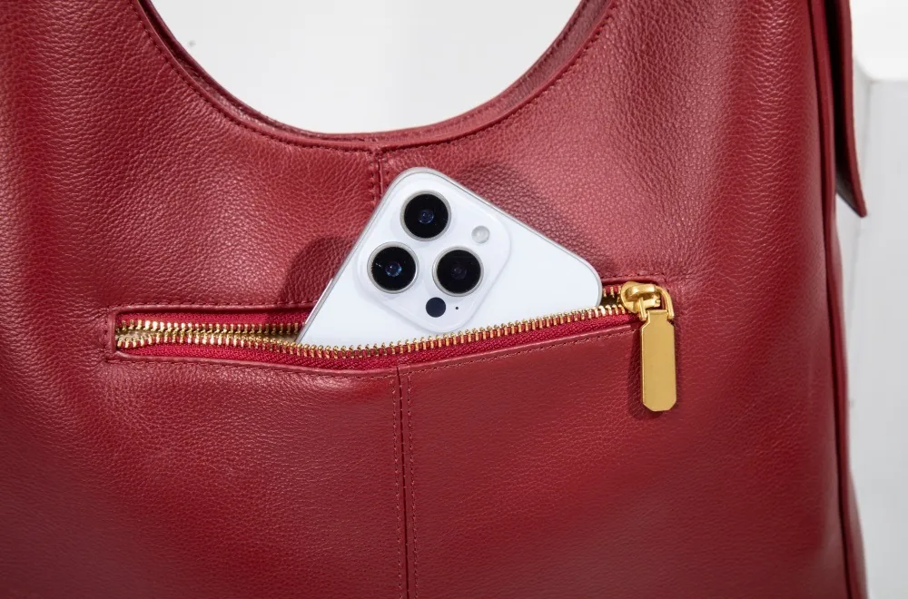 Genuine leather women's tote with rear zip pocket—quick access, secure storage, merging style and convenience.