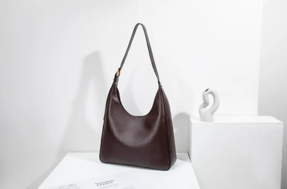 A large women's tote—roomy enough for work, travel, or daily hauls. Structured yet lightweight, with sleek lines and practical pockets. Combines functionality with effortless style for every occasion