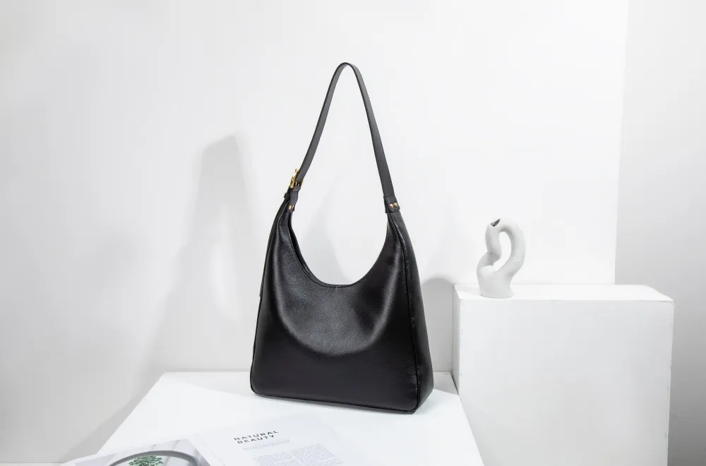 A large women's tote—roomy enough for work, travel, or daily hauls. Structured yet lightweight, with sleek lines and practical pockets. Combines functionality with effortless style for every occasion