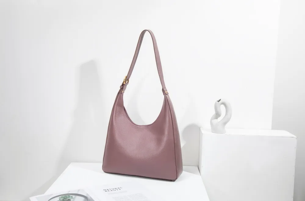 A large women's tote—roomy enough for work, travel, or daily hauls. Structured yet lightweight, with sleek lines and practical pockets. Combines functionality with effortless style for every occasion