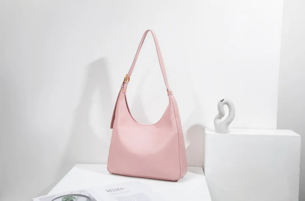A large women's tote—roomy enough for work, travel, or daily hauls. Structured yet lightweight, with sleek lines and practical pockets. Combines functionality with effortless style for every occasion