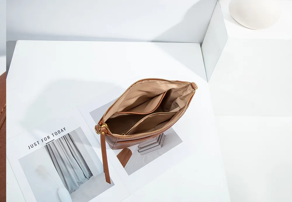 Despite its compact silhouette, this BALIYA crossbody bag boasts a surprisingly spacious and organized interior.
