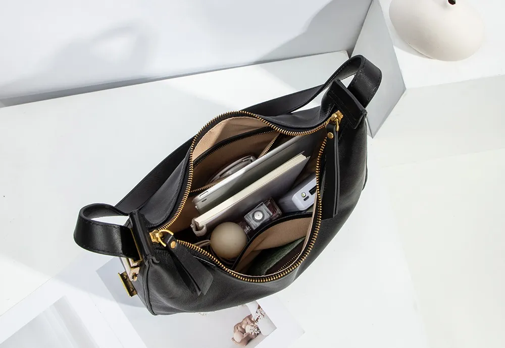 This bag's voluptuous crescent-shaped silhouette naturally provides ample space.